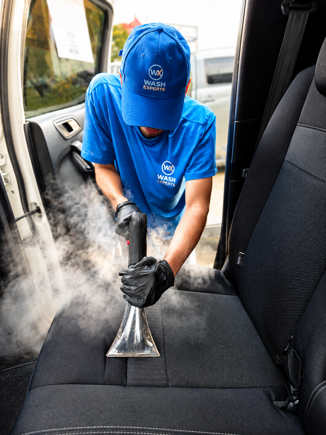 Professional car interior steam cleaning service at Wash Experts Hand Car Wash near Highpoint, Maribyrnong.